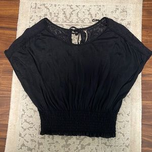 Free People Black Top. XS but runs large. See through back.